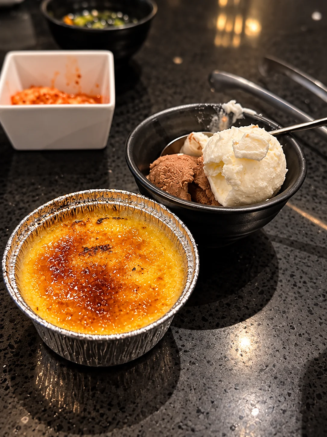 Crème brûlée and ice cream at the table